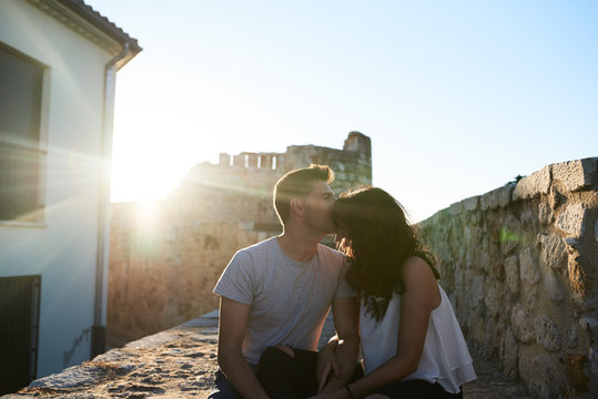 Boyfriend kissing his girlfriend forehead