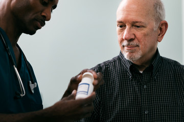 Exam: Doctor Opening Prescription Medicine Bottle