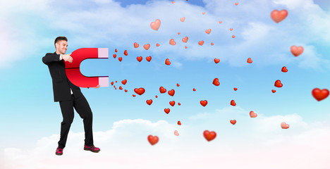 handsome man holding horse shoe attracting love hearts, lover boy, successful man, love and...