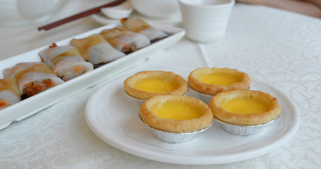 Eat egg tart in the chinese restaurant