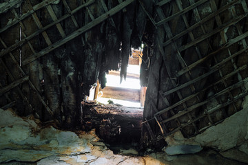 Hole in the ceiling in the destroyed building, war