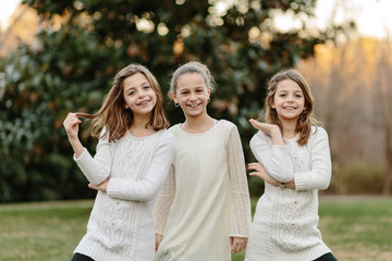 Three sister doing silly poses together