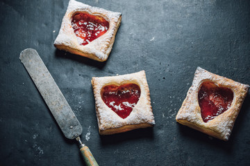 Food: little puff pastry with strawberry jam filling, heart shap