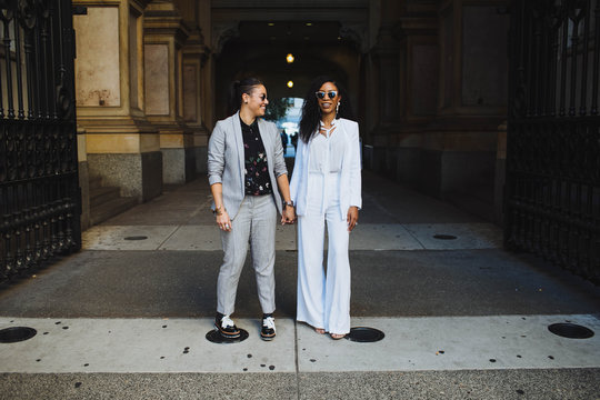 Just married couple standing under arch