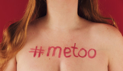 Anonymous woman has the phrase ""#metoo"" written on her chest as a sign of solidarity