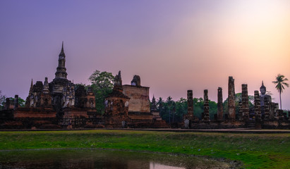 Fototapeta premium Scenery Beautiful Sunset in Wat MahaThat Sukhothai Province , Thailand.