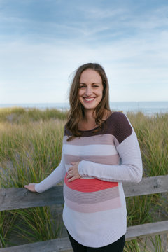 Portrait of beautiful pregnant woman on the beach.