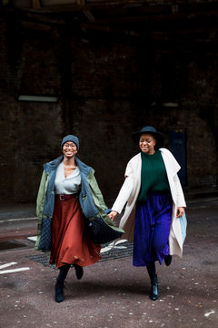 Stylish female friends meeting  in London