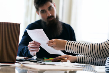 Taxes: Woman Shows Tax Return To Man