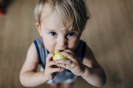 Boy eating apple