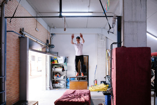 Young man jumping in gym
