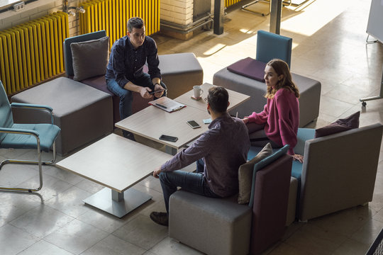 People Discussing Business At The Open Space Office