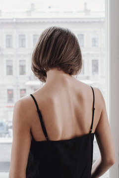 Back view of a woman with short haircut