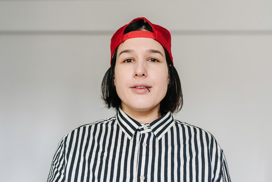 Portrait of a tomboy female model at home