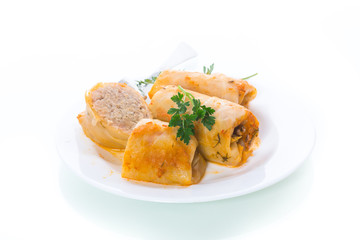 Stuffed cabbage leaves with minced meat and rice in tomato sauce.