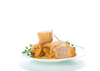 Stuffed cabbage leaves with minced meat and rice in tomato sauce.
