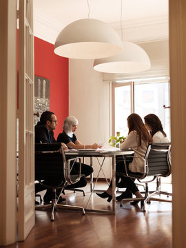 Coworkers in modern office having meeting