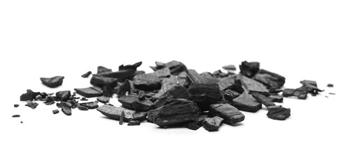 Black charcoal chunks, pile isolated on white background