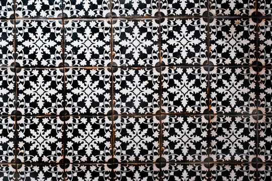 A vintage black and white ceramic tile floor.