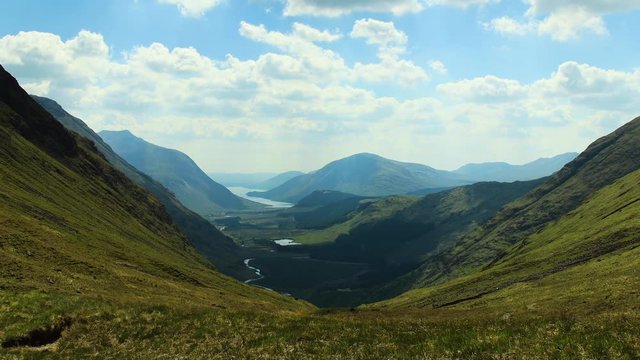 time lapse footage of loch etive and glen etive shot on a summer's day with broken clouds and blue skies