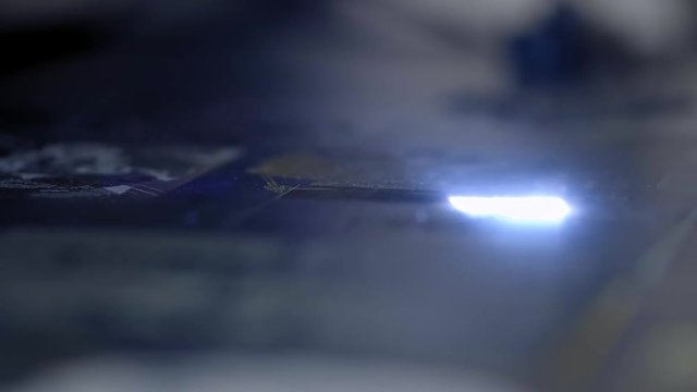 laser engraving on metal. Make a jewel. New technologies in metal processing and jewelry. Glowing laser beam burns on the metal. Macro, clouse up