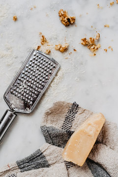 Parmesan and walnuts on marble background