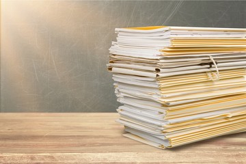 File folders with documents isolated on white background