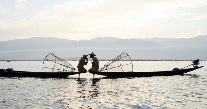 Two traditional Shan fishermen at Inle Lake, Myanmar.