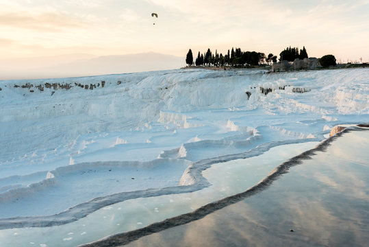 Skydivers flying over limestone landscape