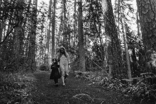 Mother and weird child in the forest