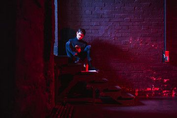 Actor reviewing script in theatre.