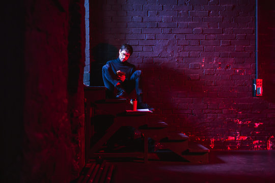 Actor reviewing script in theatre.