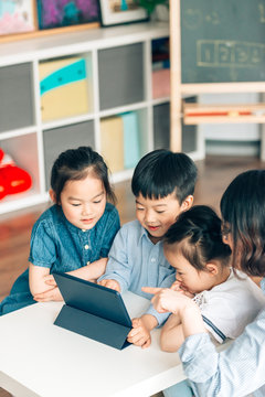 Students learning with digital tablets