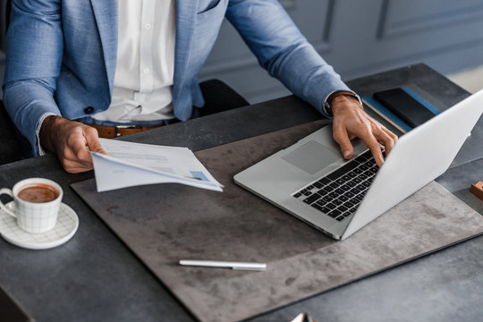 A Businessman Working at His Office