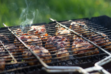 Fragrant chicken legs in the grill.