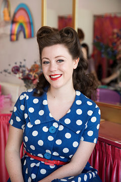 Beauty shoot - young woman having makeup applied by make up artist