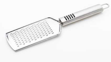 Metallic grater for cheese and other foods (collection of kitchen objects). Isolated on white background.