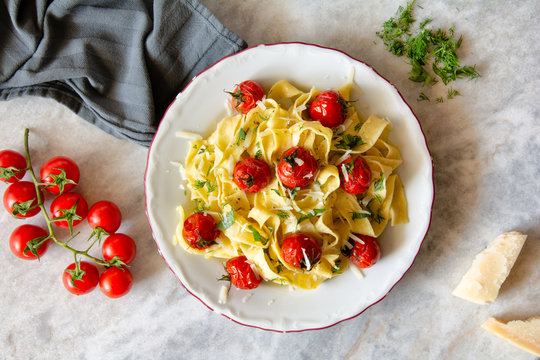 Tagliatelle pasta with oven roasted tomatoes and Parmesan cheese