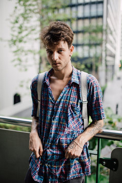 Portrait of tattooed skater in Bangkok downtown