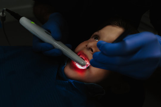 Dentist working on child teeth