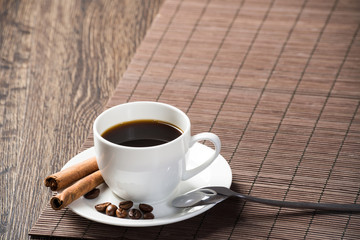 Cup of espresso coffee on wooden table