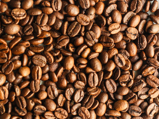 coffee beans (good and bad grain) - arabica and robusta blend (roasted coffee grain). Black background. Top view . Copy space