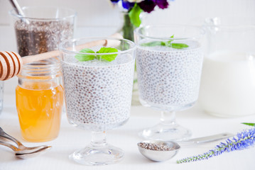 Chia seeds yogurt pudding with honey in glasses for breakfast