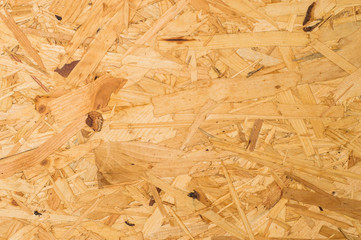 Wood texture of Oriented Strand Board, Osb. Chipboard plywood yellow and orange texture background.