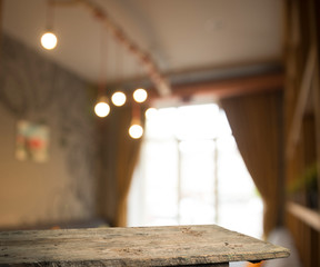 Empty wooden table in front of abstract blurred background of coffee shop . can be used for display or montage your products.Mock up for display of product
