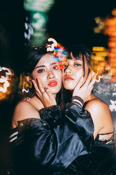 Portrait of  two beautiful asian girl in the city