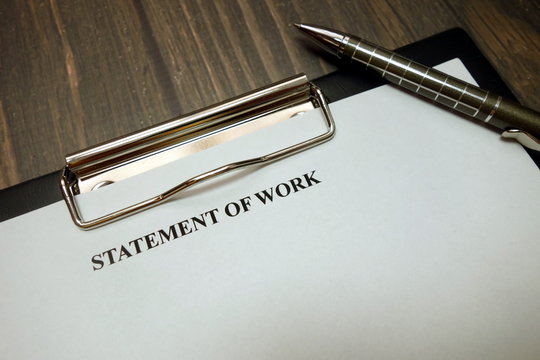 Clipboard with statement of work mockup and pen