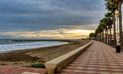 Sunset view of beach promenade in Costacabana, on the Mediterranean coast of Almeria, Spain. © Lux Blue