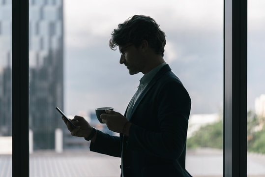 Handsome businessman working at the office.