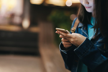 Teen girl using mobile phone to chat and send message.